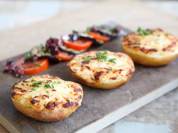 Cheesy potatoes with black olive, tomato & aubergine salad