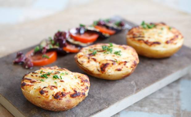 Cheesy potatoes with black olive, tomato & aubergine salad